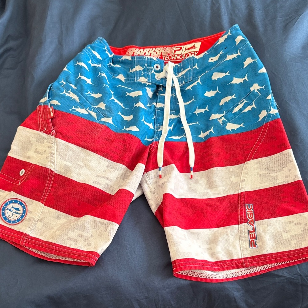 Pelagic Boys Sharkskin Red and Blue Fishing Board Shorts size Youth 25 adj waist